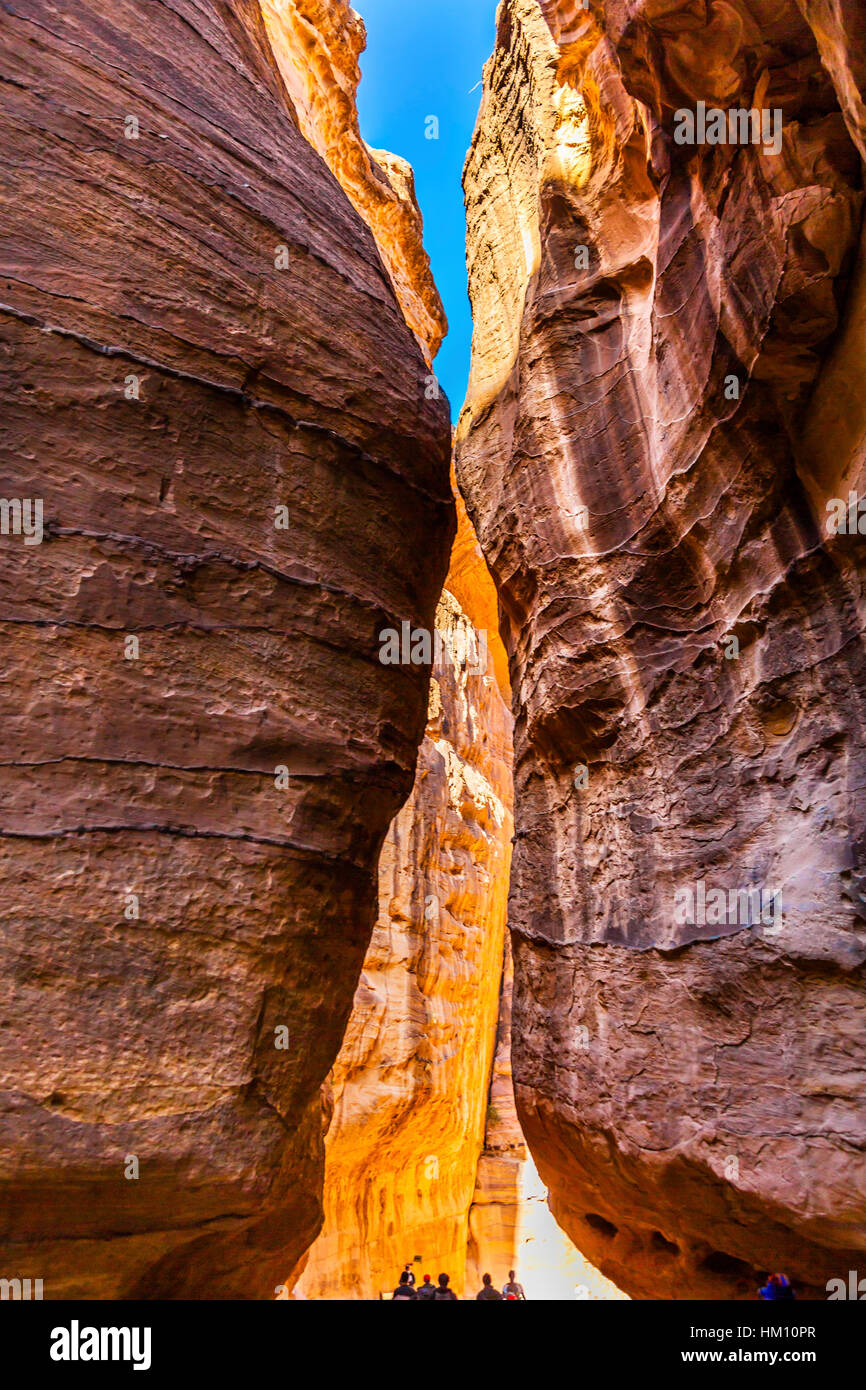 Outer Siq Yellow Canyon Morning Hiking To Entrance Into Petra Jordan Petra Jordan.  Colorful Yellow Pink Canyon becomes rose red when sun goes Stock Photo