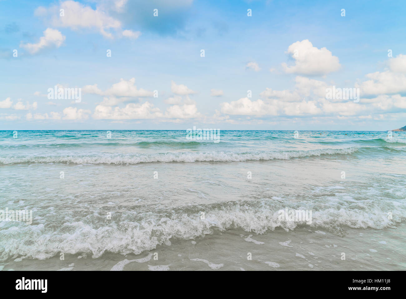 Beautiful white sand beach with blue sea and sky Stock Photo - Alamy