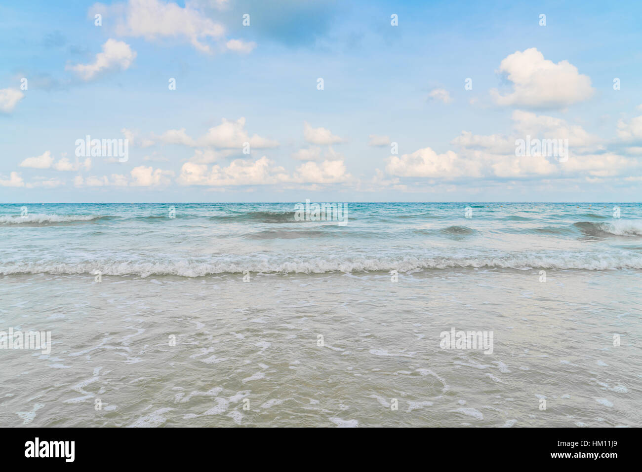 Beautiful white sand beach with blue sea and sky Stock Photo - Alamy