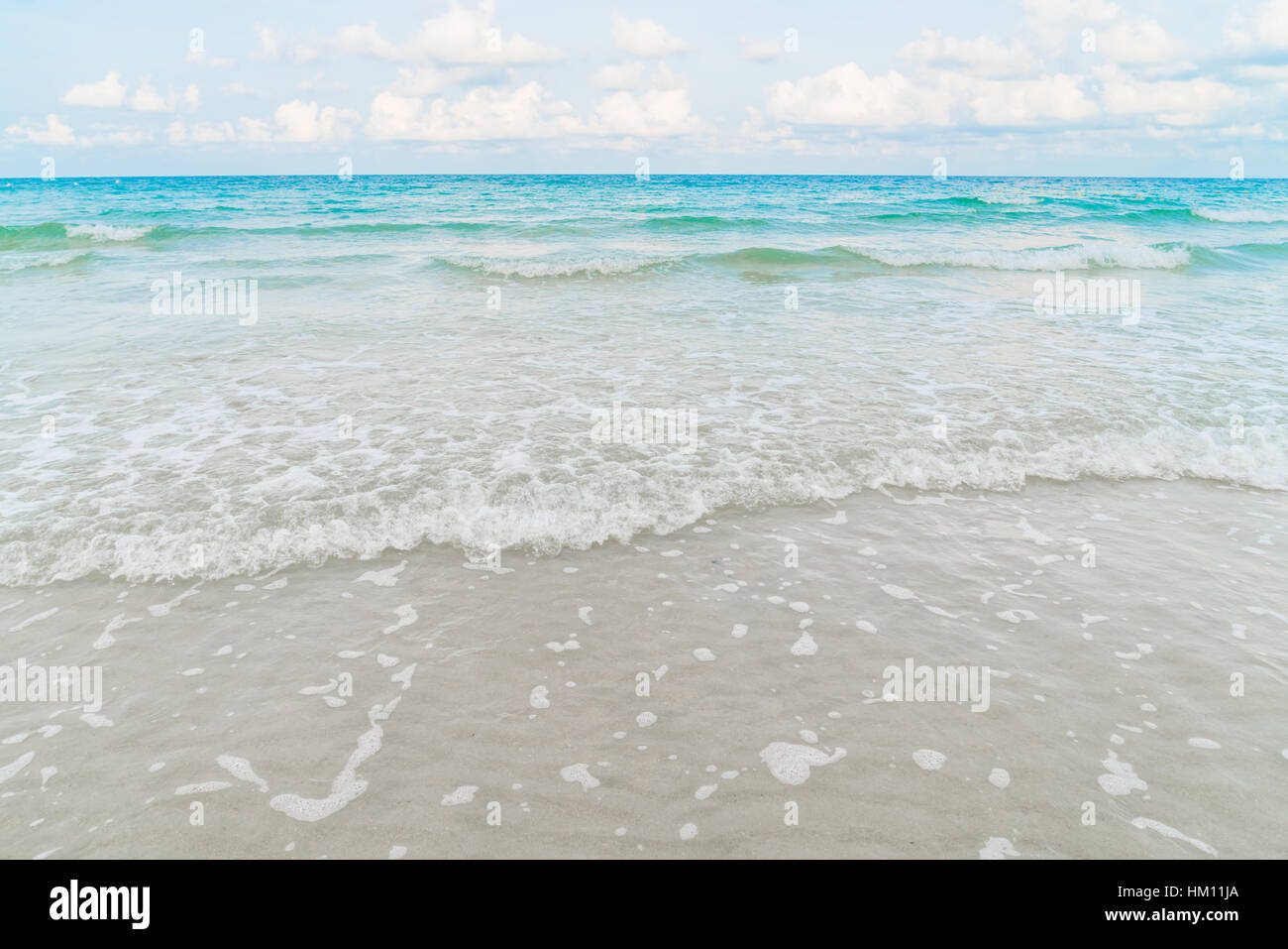Beautiful white sand beach with blue sea and sky Stock Photo - Alamy