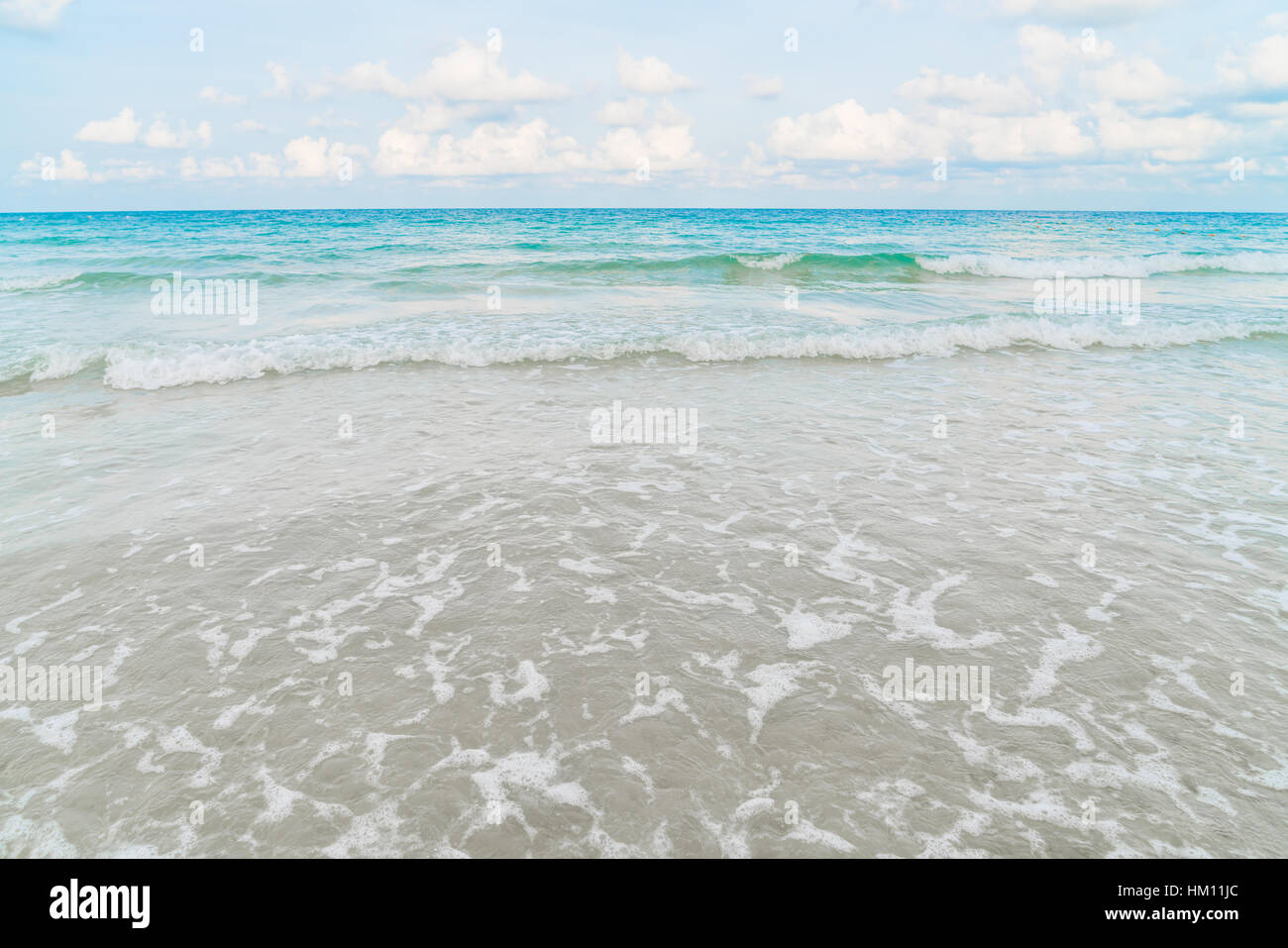 Beautiful white sand beach with blue sea and sky Stock Photo - Alamy