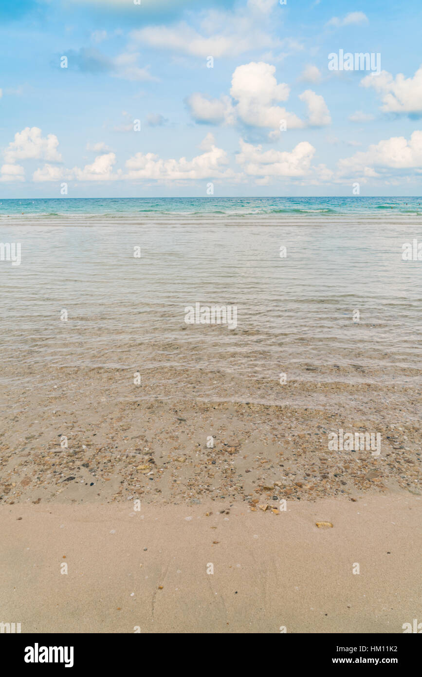 Beautiful white sand beach with blue sea and sky Stock Photo - Alamy