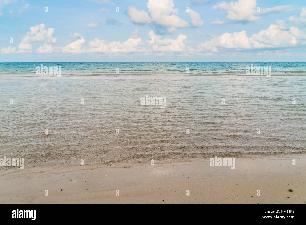 Beautiful white sand beach with blue sea and sky Stock Photo - Alamy
