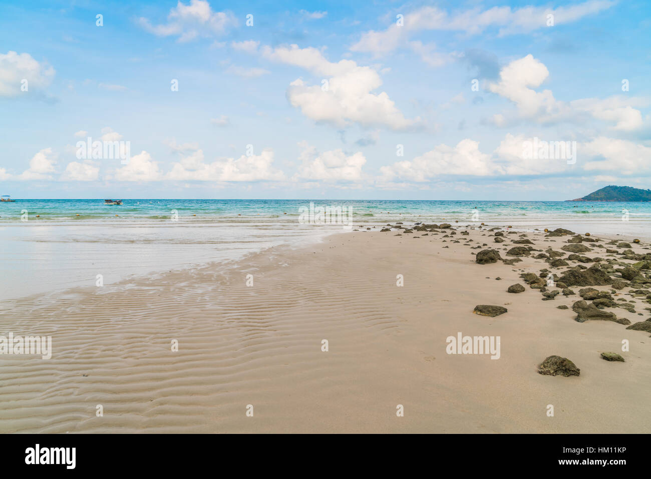 Beautiful white sand beach with blue sea and sky Stock Photo - Alamy