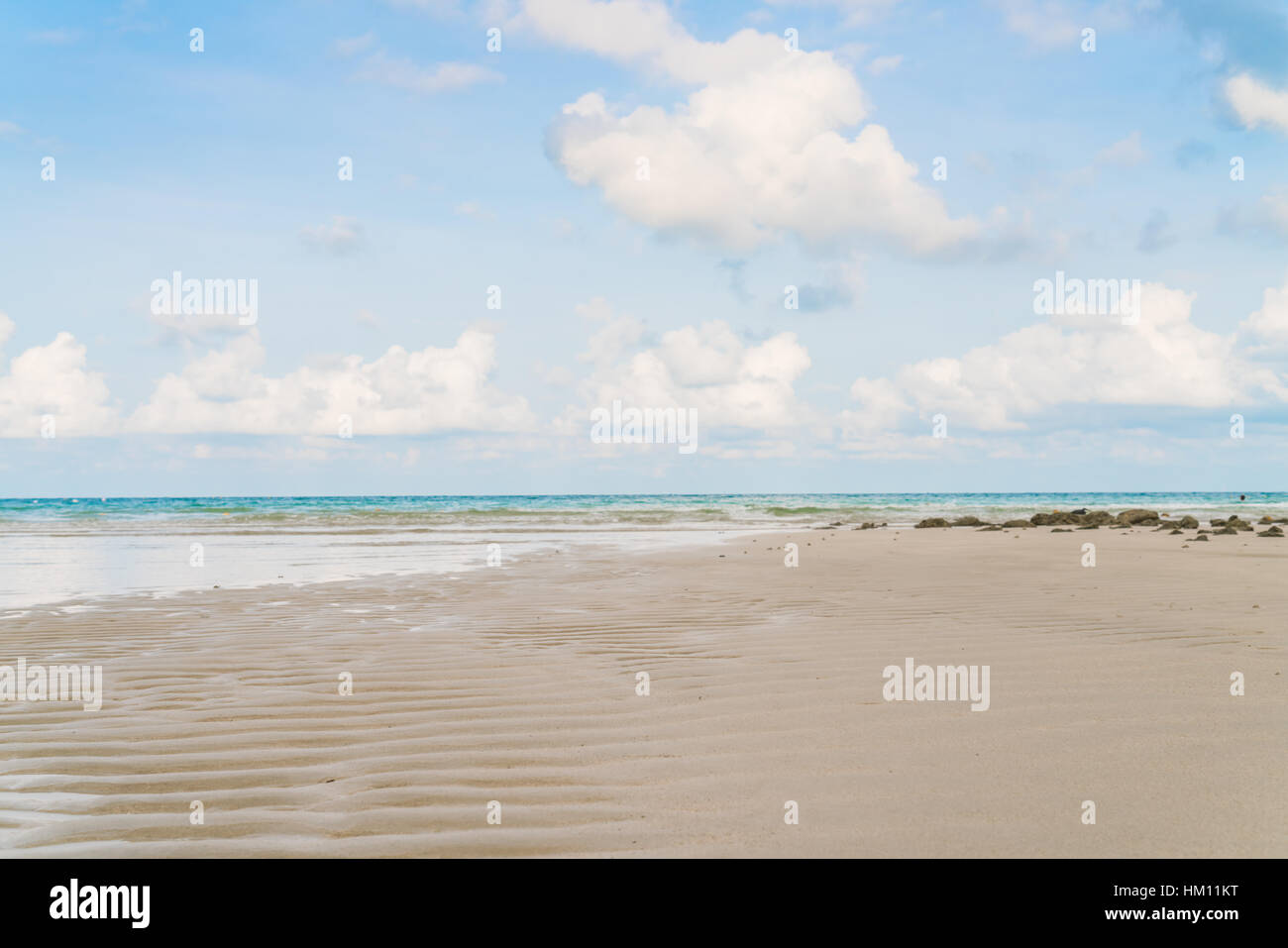Beautiful white sand beach with blue sea and sky Stock Photo - Alamy