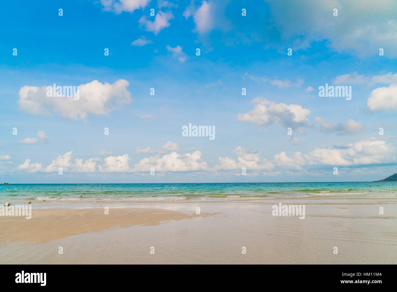 Beautiful white sand beach with blue sea and sky Stock Photo - Alamy
