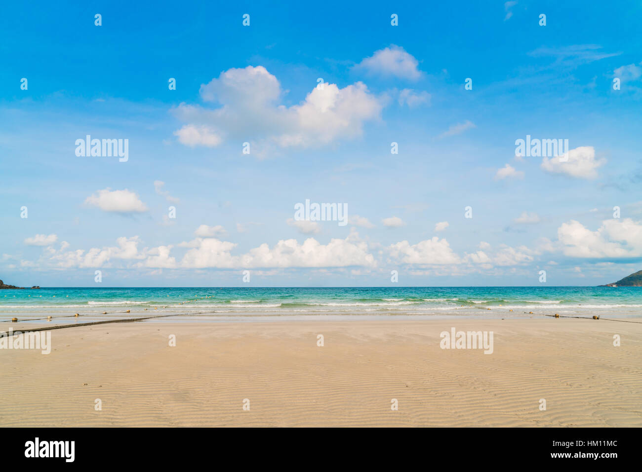Beautiful white sand beach with blue sea and sky Stock Photo - Alamy