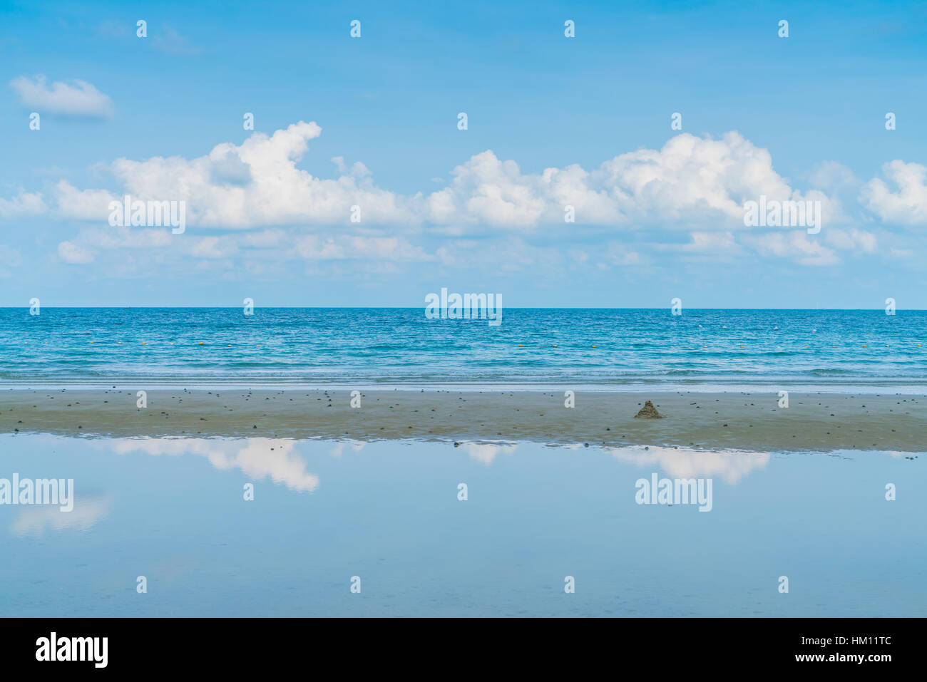 Beautiful white sand beach with blue sea and sky Stock Photo - Alamy