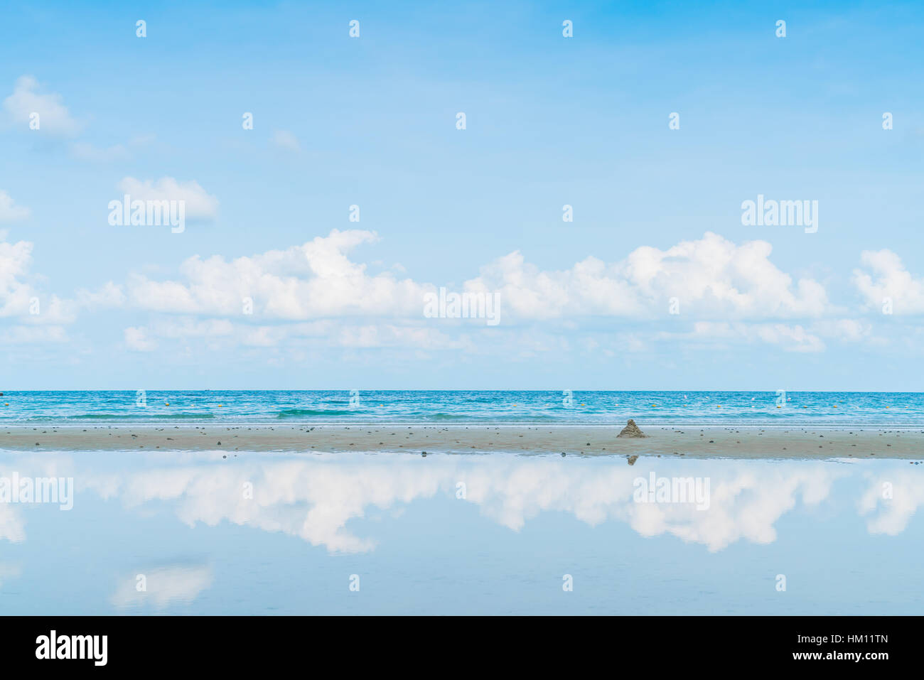Beautiful white sand beach with blue sea and sky Stock Photo - Alamy