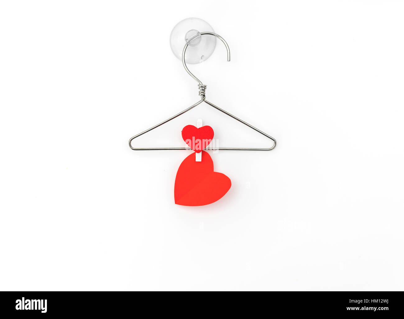 Red paper heart hanging on white background Stock Photo - Alamy