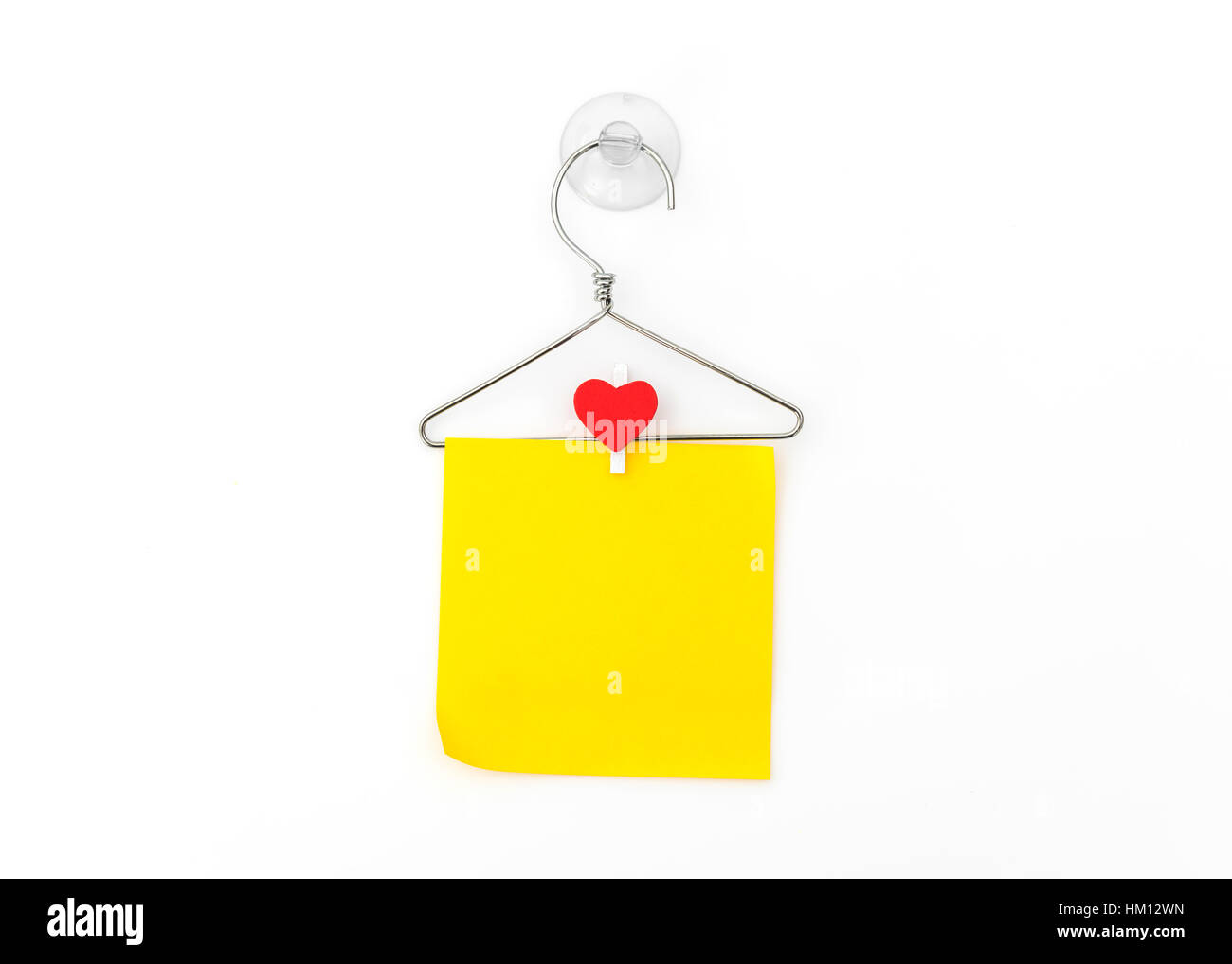 Red paper heart hanging on white background Stock Photo - Alamy