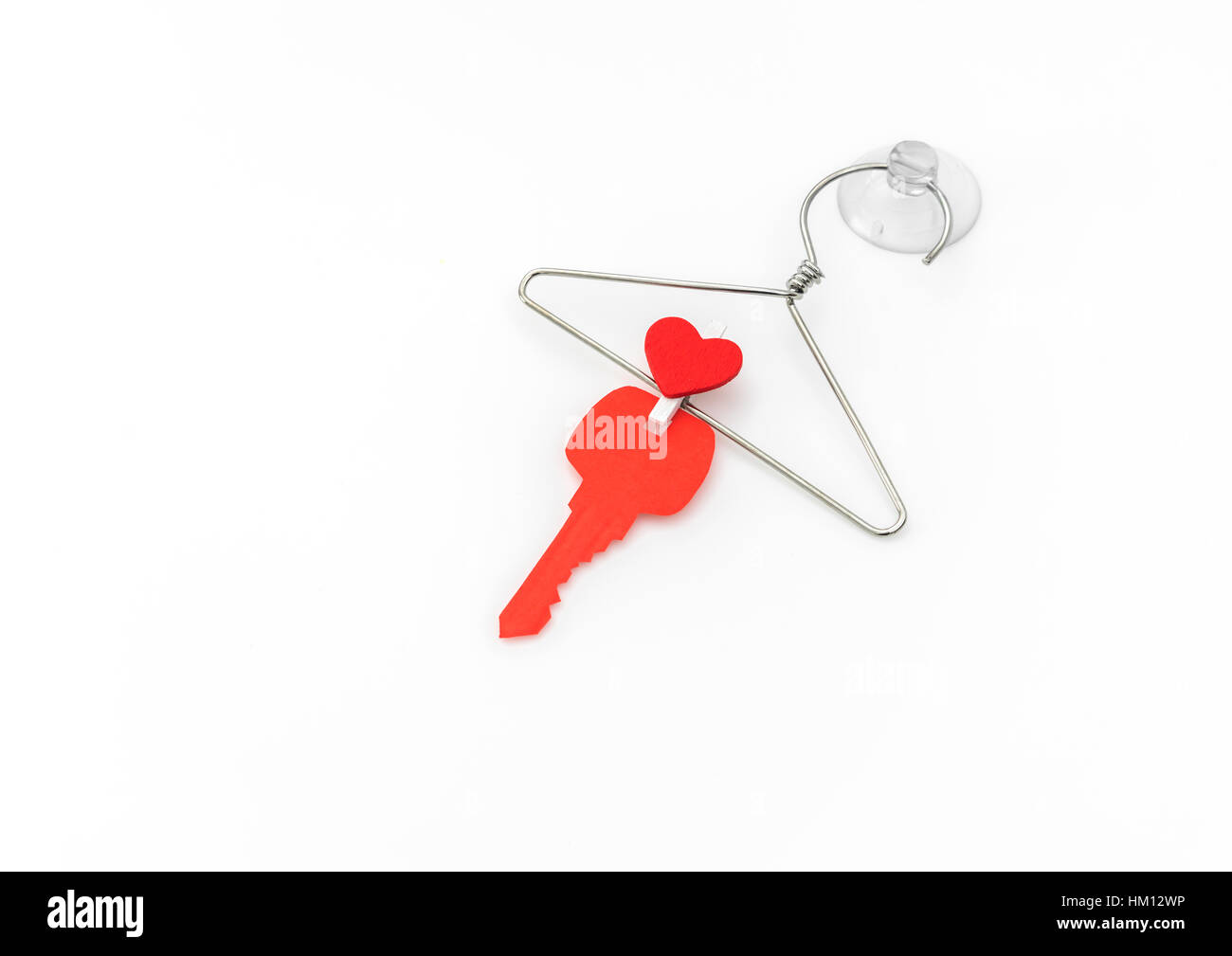 Red paper heart hanging on white background Stock Photo - Alamy