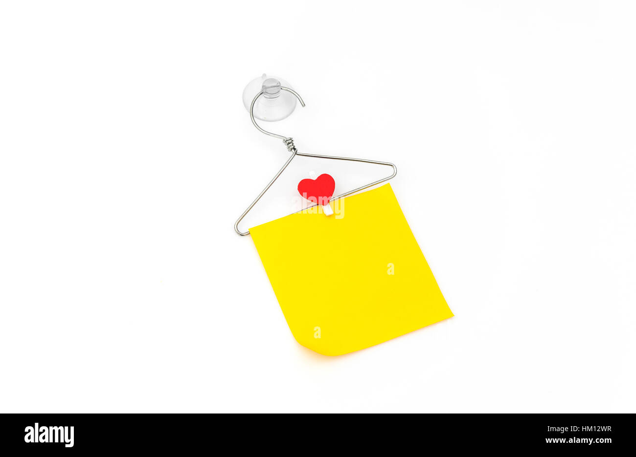 Red paper heart hanging on white background Stock Photo - Alamy