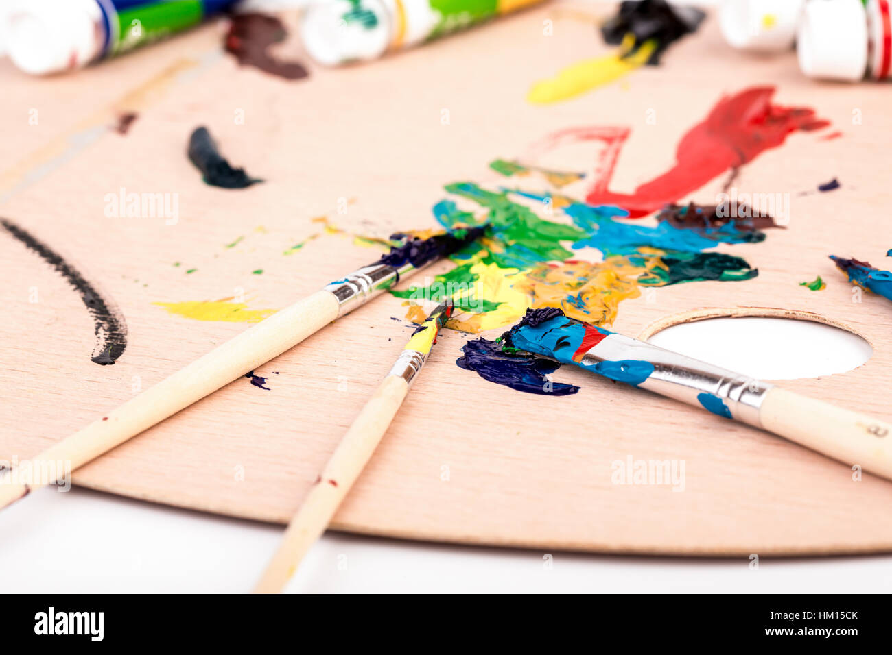 Wooden art palette with paint brush on white background Stock Photo - Alamy