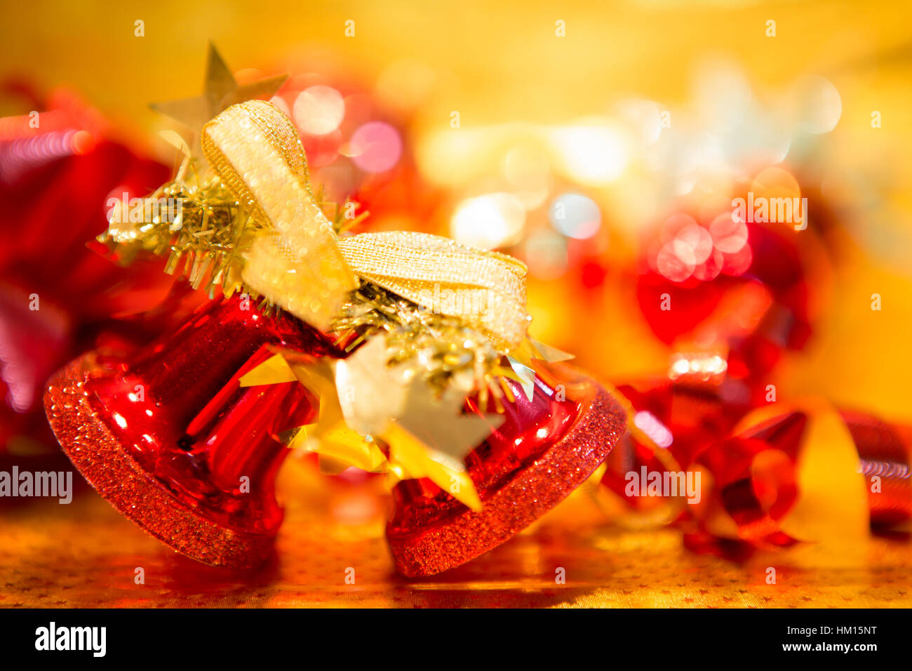 Red Christmas balls on a gold background Stock Photo - Alamy