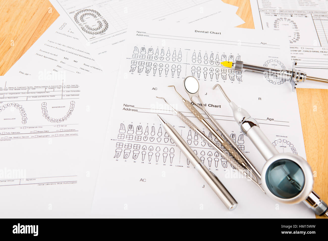 Dental tools and equipment on dental chart Stock Photo Alamy