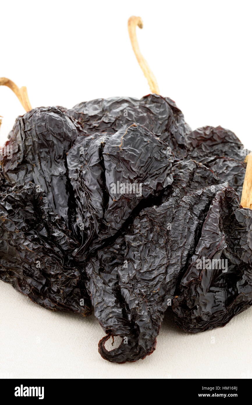 delicious dried chili peppers great for mexican food and fusion cuisine. these chili pods will leave a hot spicy and flavorful sensation to your favor Stock Photo