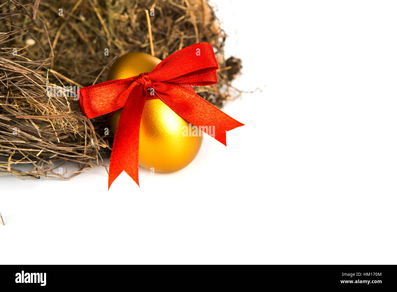 Golden easter eggs in nest isolated on white background Stock Photo - Alamy