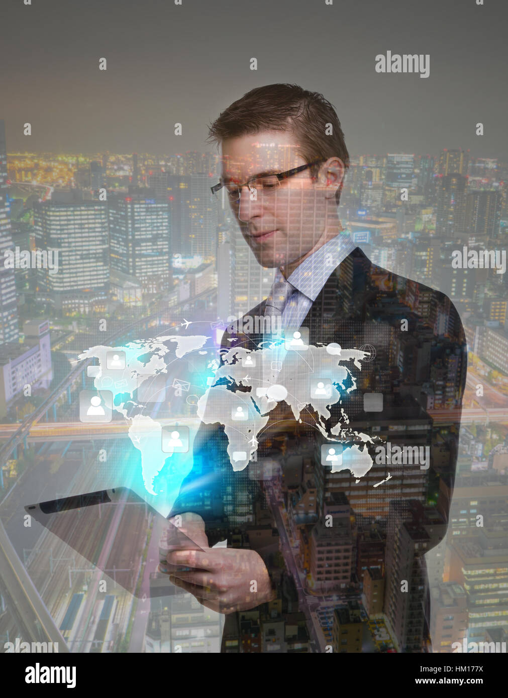 Double exposure of businessman using touch screen device with cityscape ...