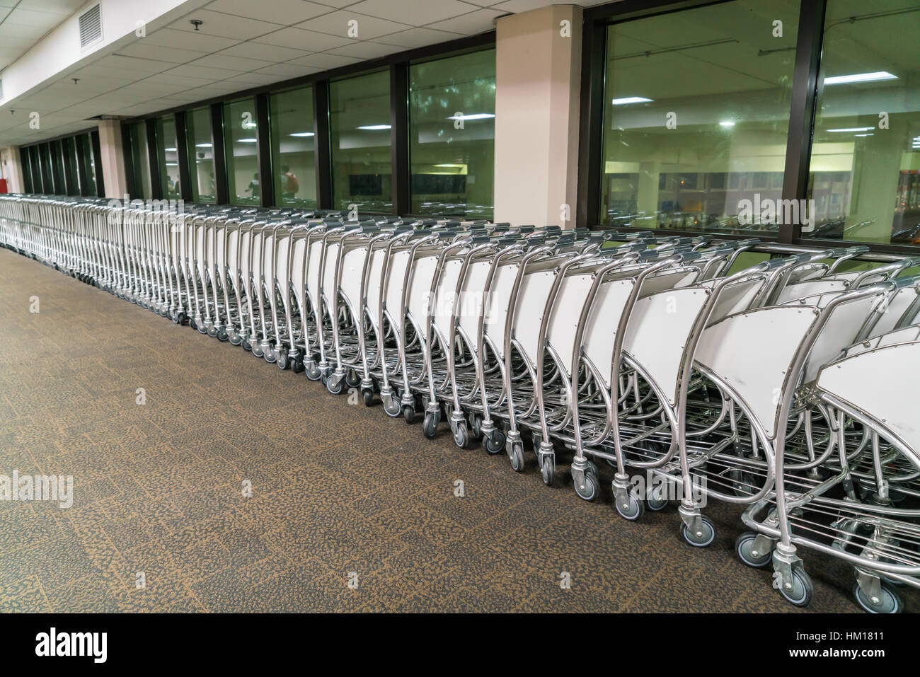 luggage carts at airport terminal Stock Photo Alamy