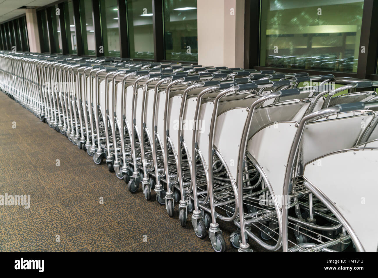 luggage carts at airport terminal Stock Photo Alamy
