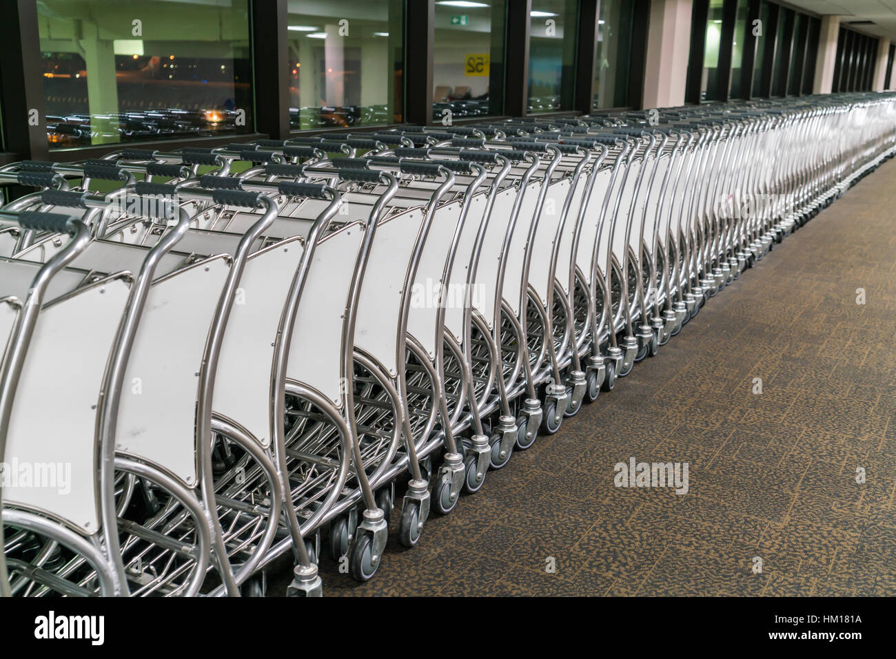 luggage carts at airport terminal Stock Photo Alamy