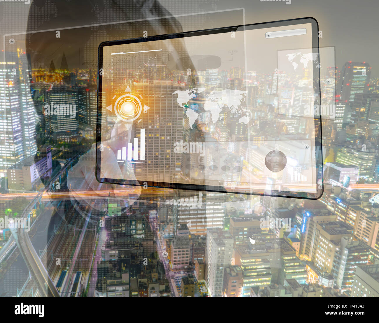 Double exposure of businessman using touch screen device with cityscape ...