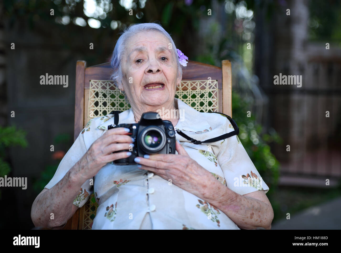grandma try take photo with modern DSLR camera Stock Photo - Alamy