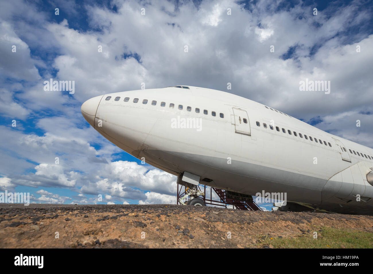Big head plane on runways with cloud and blue sky background Stock Photo