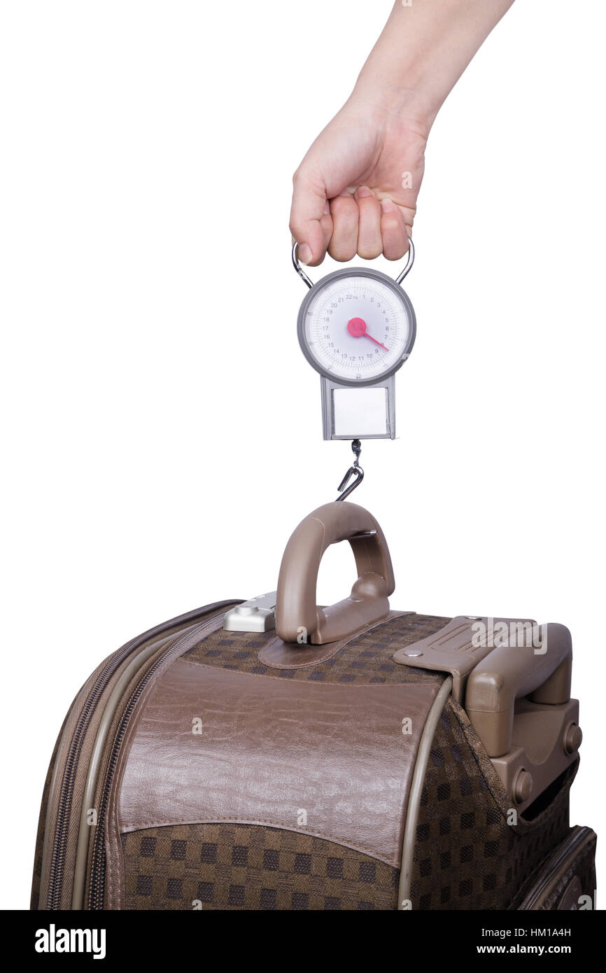 Passenger checking luggage weight with scale before flight isolated on white background Stock Photo