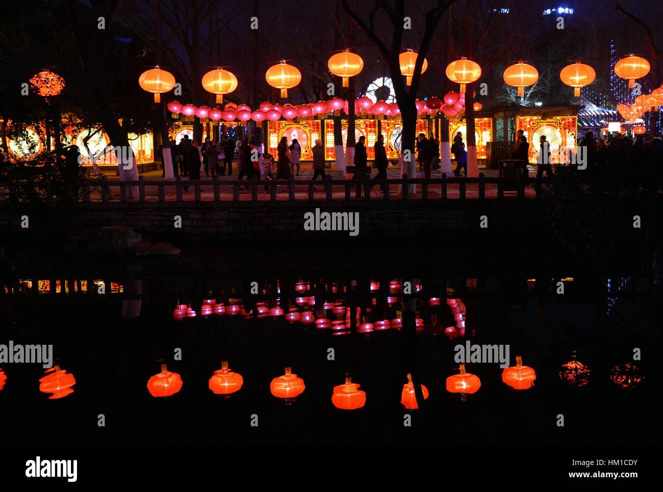 Jinan, China. 30th Jan, 2017. Tourists visit the 38th Baotu Spring ...