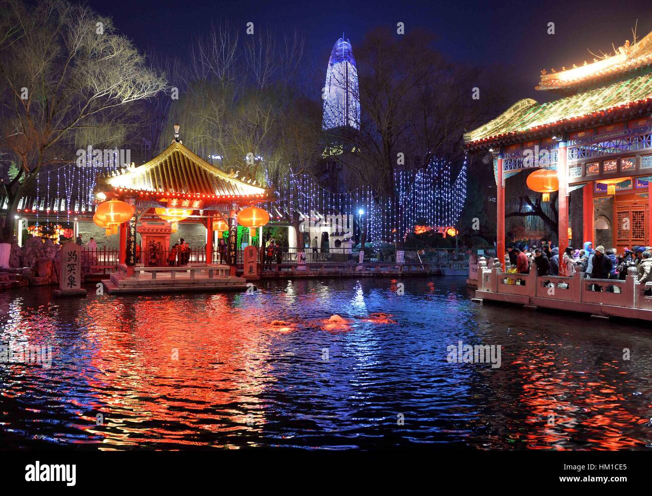 Jinan, China. 30th Jan, 2017. Tourists visit the 38th Baotu Spring ...