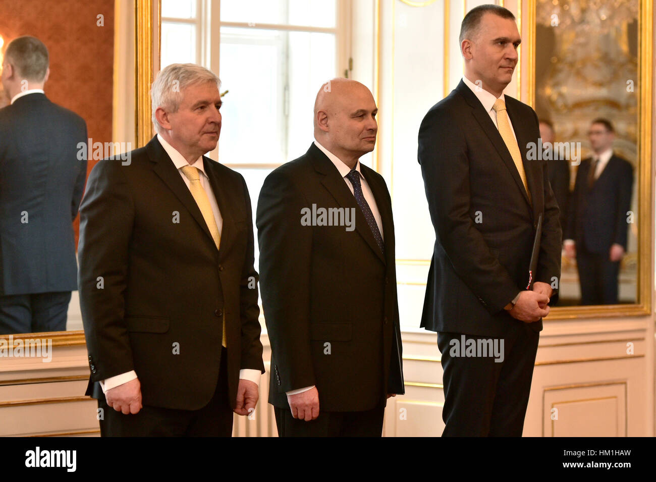 Prague, Czech Republic. 31st Jan, 2017. Czech President Milos Zeman (not pictured) named Oldrich Dedek (centre), 63, and Marek Mora (right), 45, new members of the Czech National Bank (CNB) Bank Board in Prague, Czech Republic, January 31, 2017. At left is CNB governor Jiri Rusnok. Credit: Michal Kamaryt/CTK Photo/Alamy Live News Stock Photo