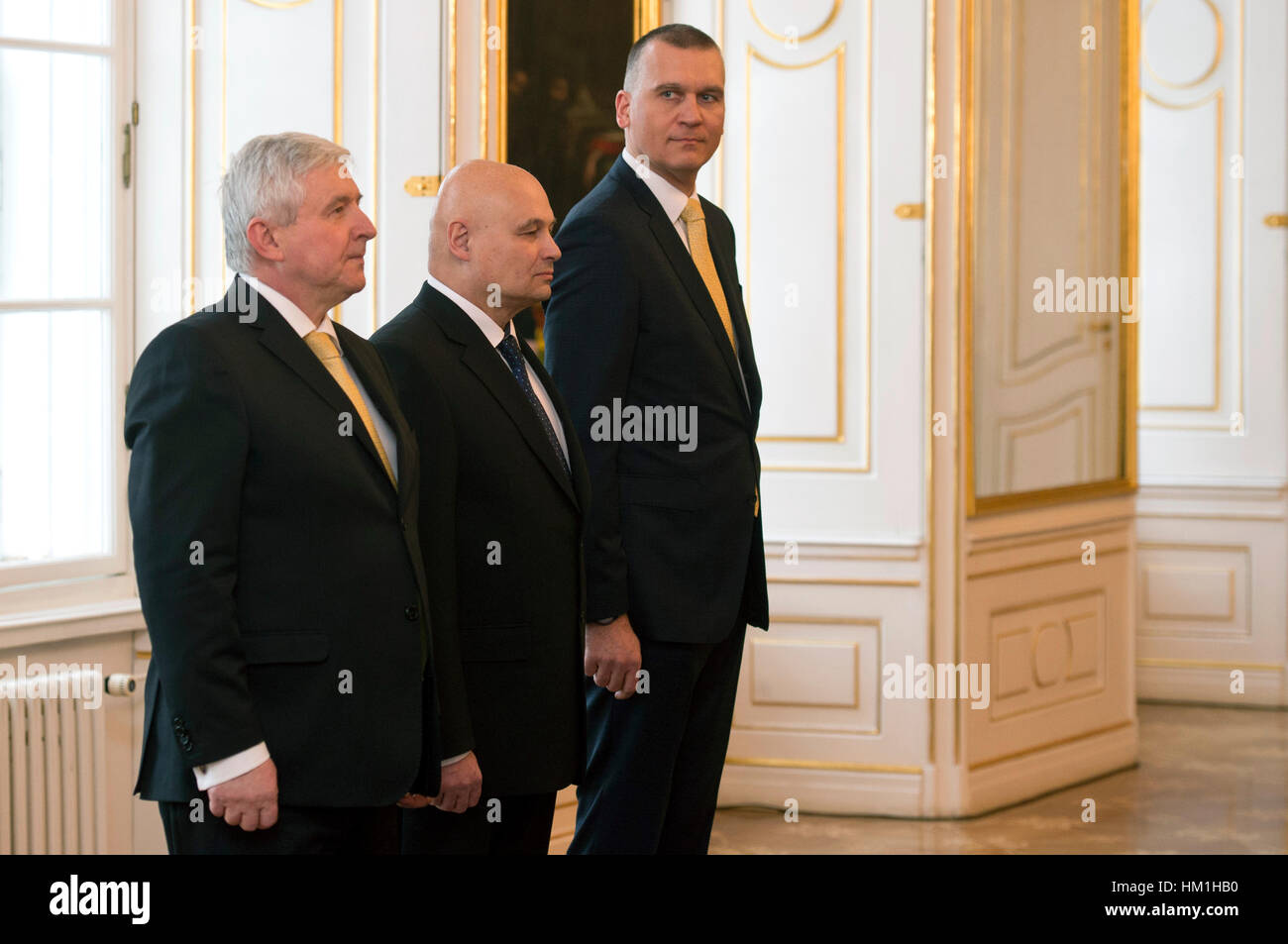 Prague, Czech Republic. 31st Jan, 2017. Czech President Milos Zeman (not pictured) named Oldrich Dedek (centre), 63, and Marek Mora (right), 45, new members of the Czech National Bank (CNB) Bank Board in Prague, Czech Republic, January 31, 2017. At left is CNB governor Jiri Rusnok. Credit: Michal Kamaryt/CTK Photo/Alamy Live News Stock Photo
