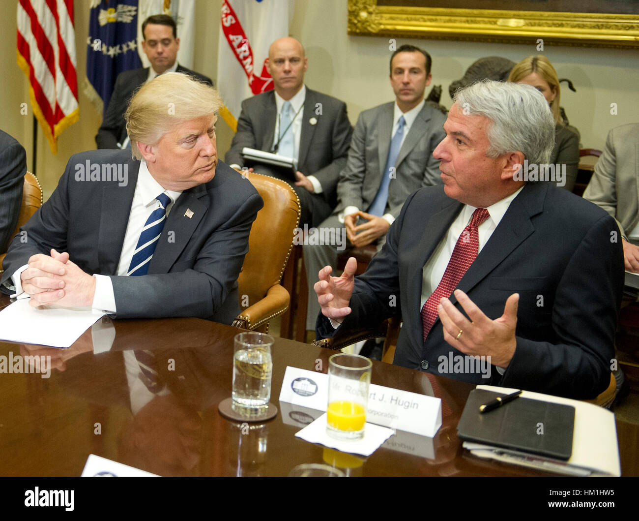 Washington DC, USA. 31st January 2017. United States President Donald Trump meets with representatives from PhRMA, the Pharmaceutical Research and Manufacturers of America in the in the Roosevelt Room of the White House in Washington, DC on Tuesday, January 31, 2017. According to its website PhRMA 'represents the country's leading biopharmaceutical researchers and biotechnology companies.' At right is Robert J. Hugin, Executive Chairman, Celgene Corporation. Credit: MediaPunch Inc/Alamy Live News Stock Photo