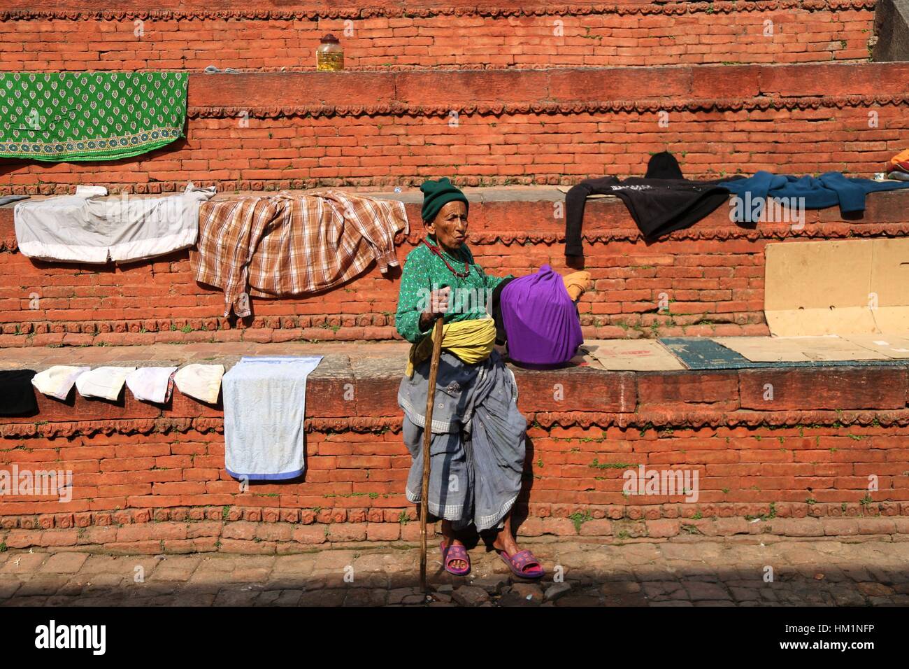 Kathmandu, Nepal. 31st Jan, 2017. An elderly woman basks in the sun at an old age home situated at Pashupati in Kathmandu, Nepal, Jan. 31, 2017. Credit: Sunil Sharma/Xinhua/Alamy Live News Stock Photo