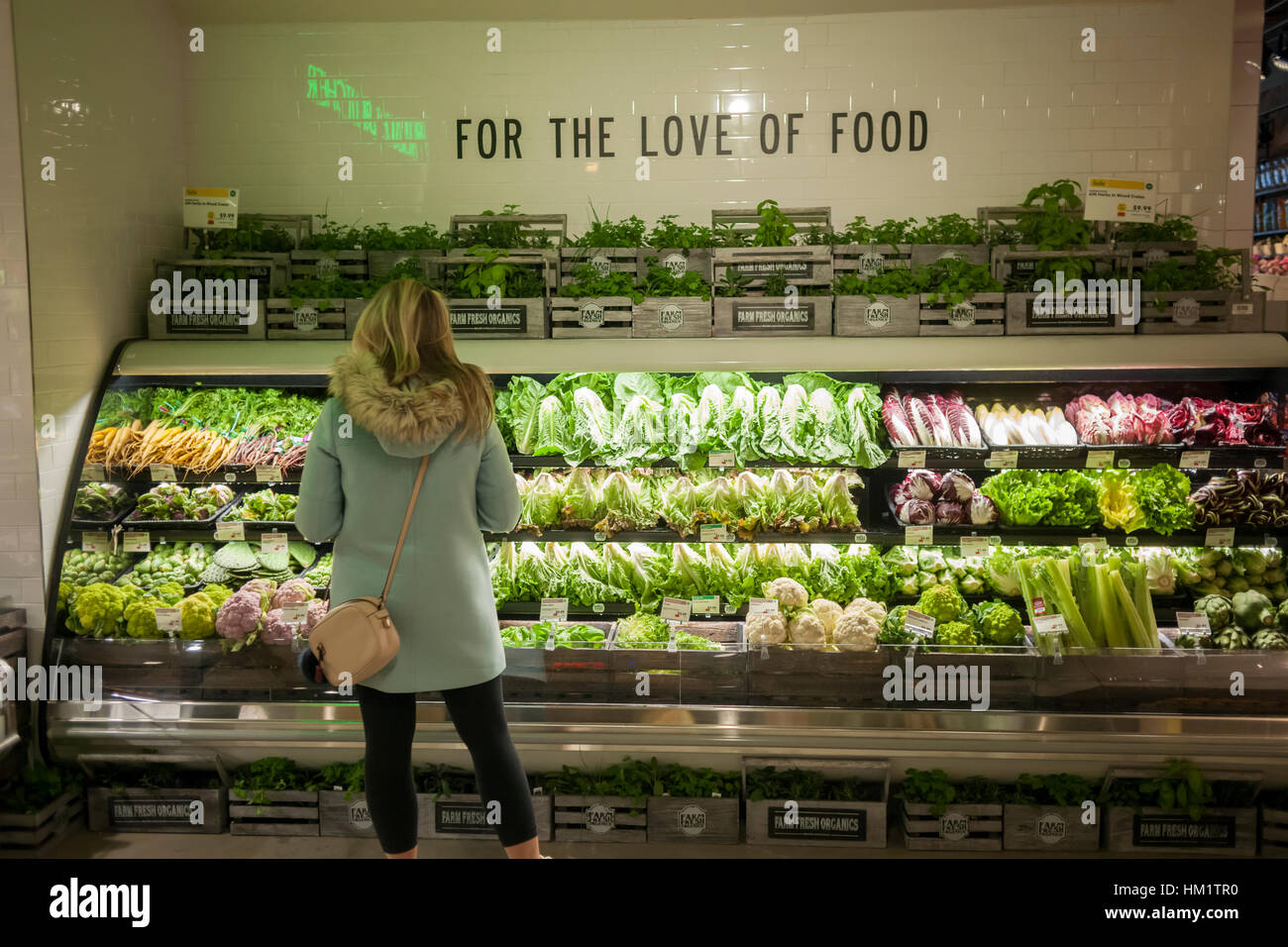 Shopper in the produce department in the new Whole Foods Market