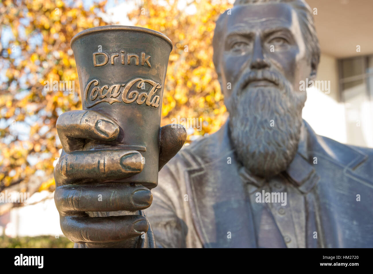 Coca-Cola inventor and founder, John Pemberton, is featured in a bronze sculpture greeting guests to the World of Coca-Cola in downtown Atlanta, GA. Stock Photo
