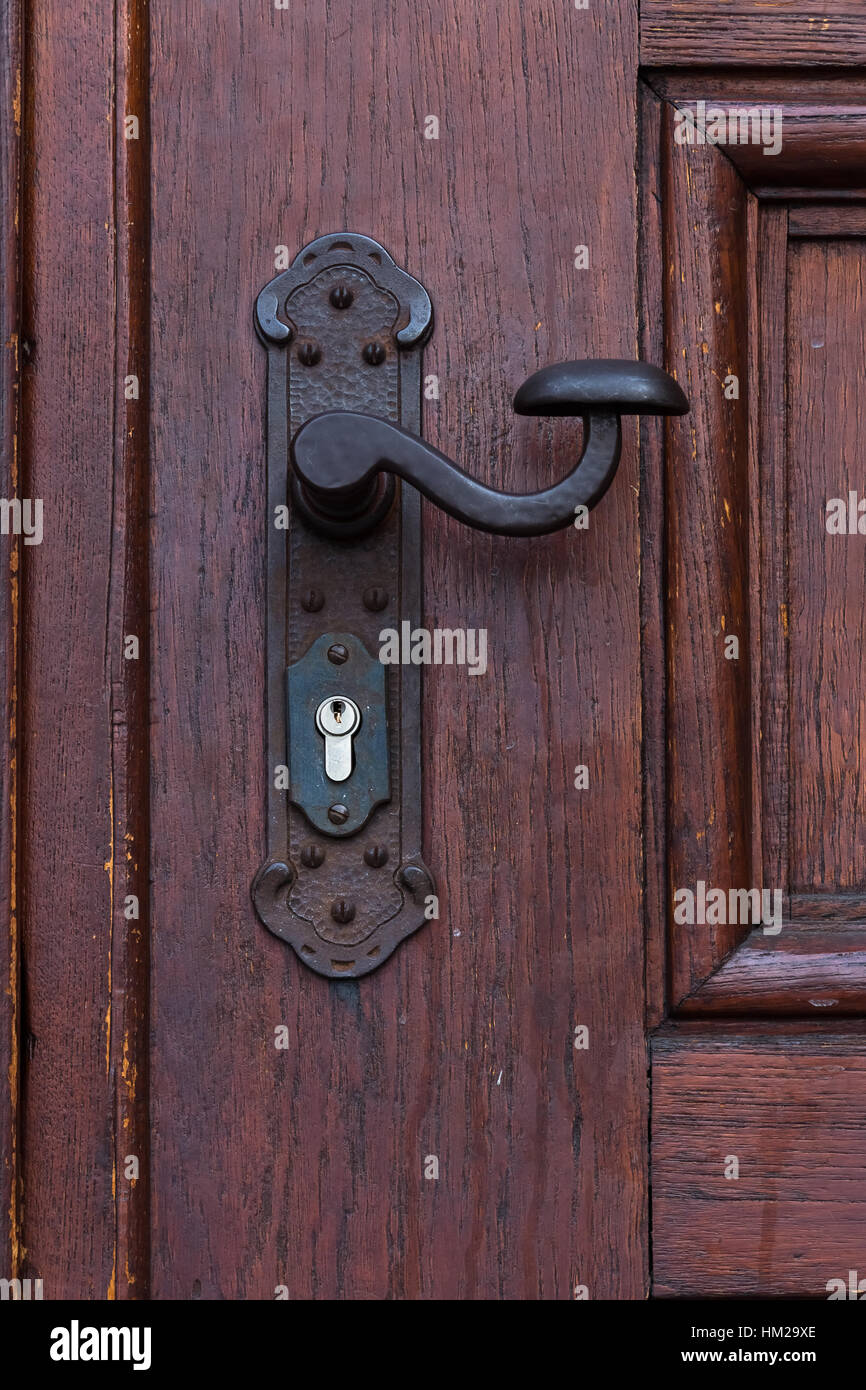 Close-up of a Massive Wooden Door with Lock and Handle Stock Photo - Alamy