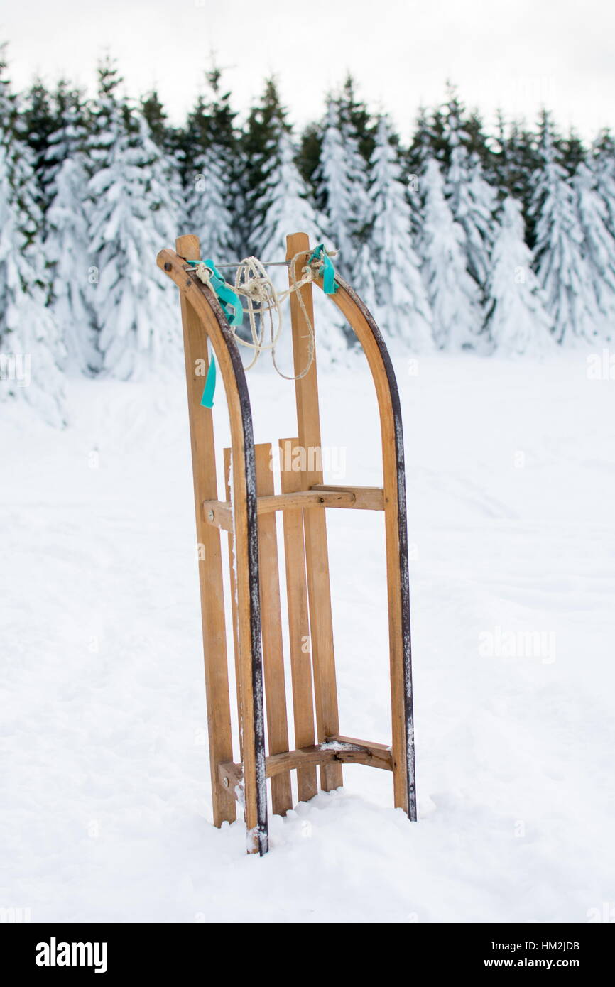 Wooden sleds on a snow covered mountain Stock Photo Alamy
