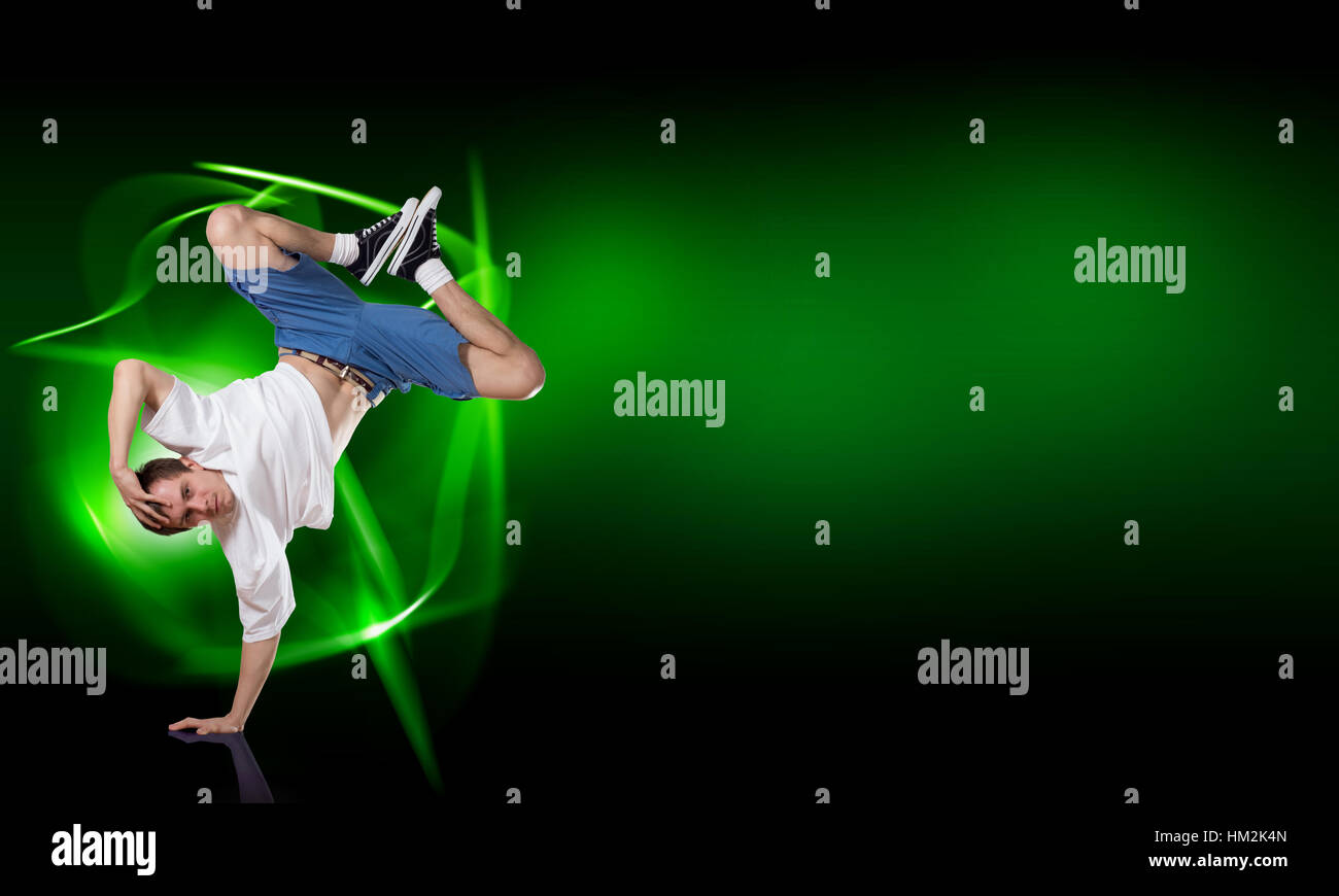 Breakdancer standing on hand Stock Photo - Alamy
