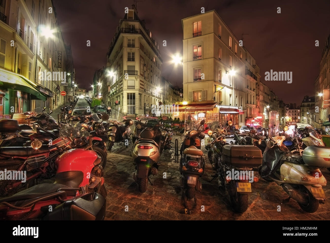 Paris. France. Motorcycles parked on the crossroads rue Maurice Utrillo, rue Paul Albert, rue Feutrier and rue Muller. Stock Photo