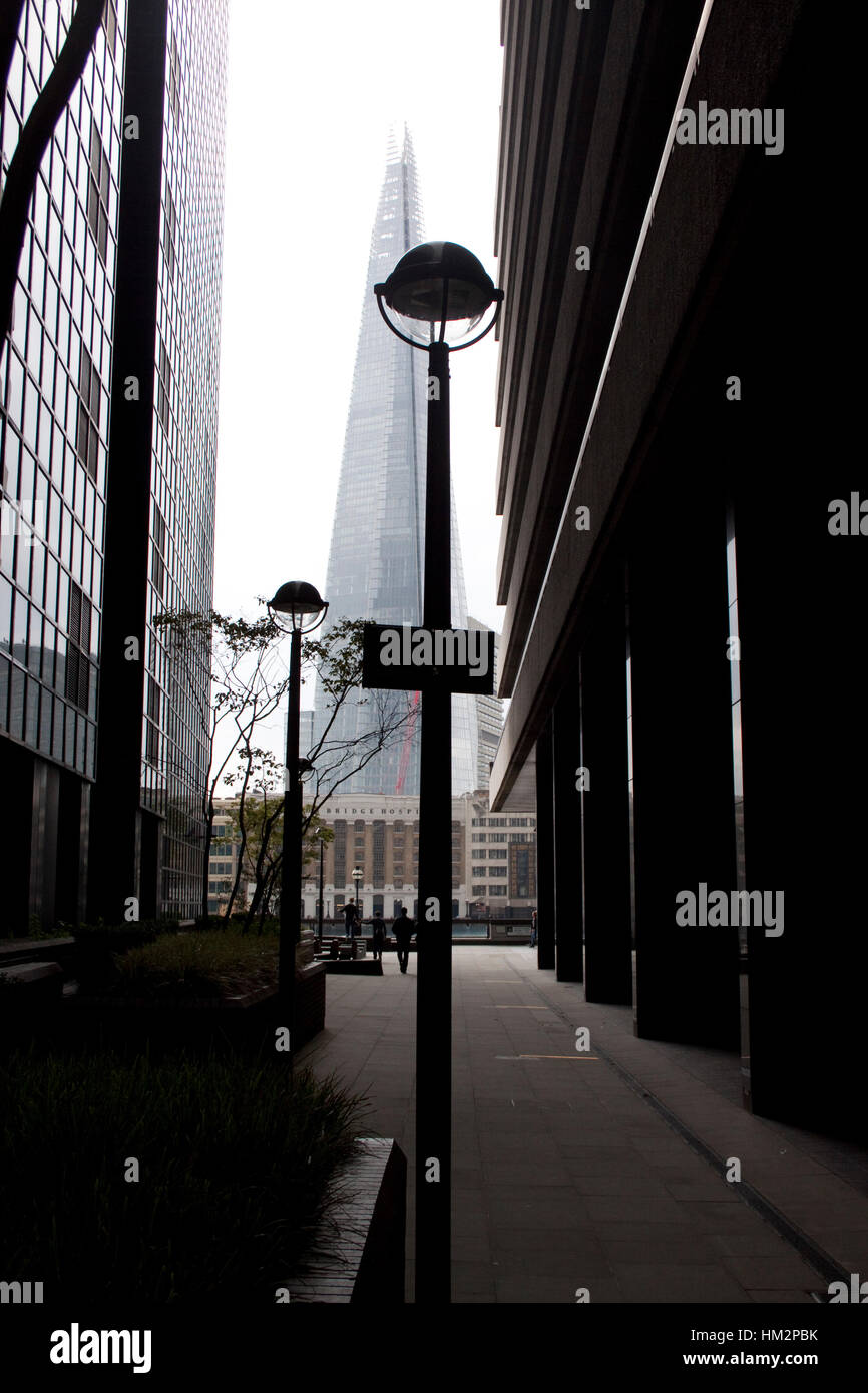 The Shard skyscraper seen from between two buildings on the opposite bank of the Thames Stock Photo