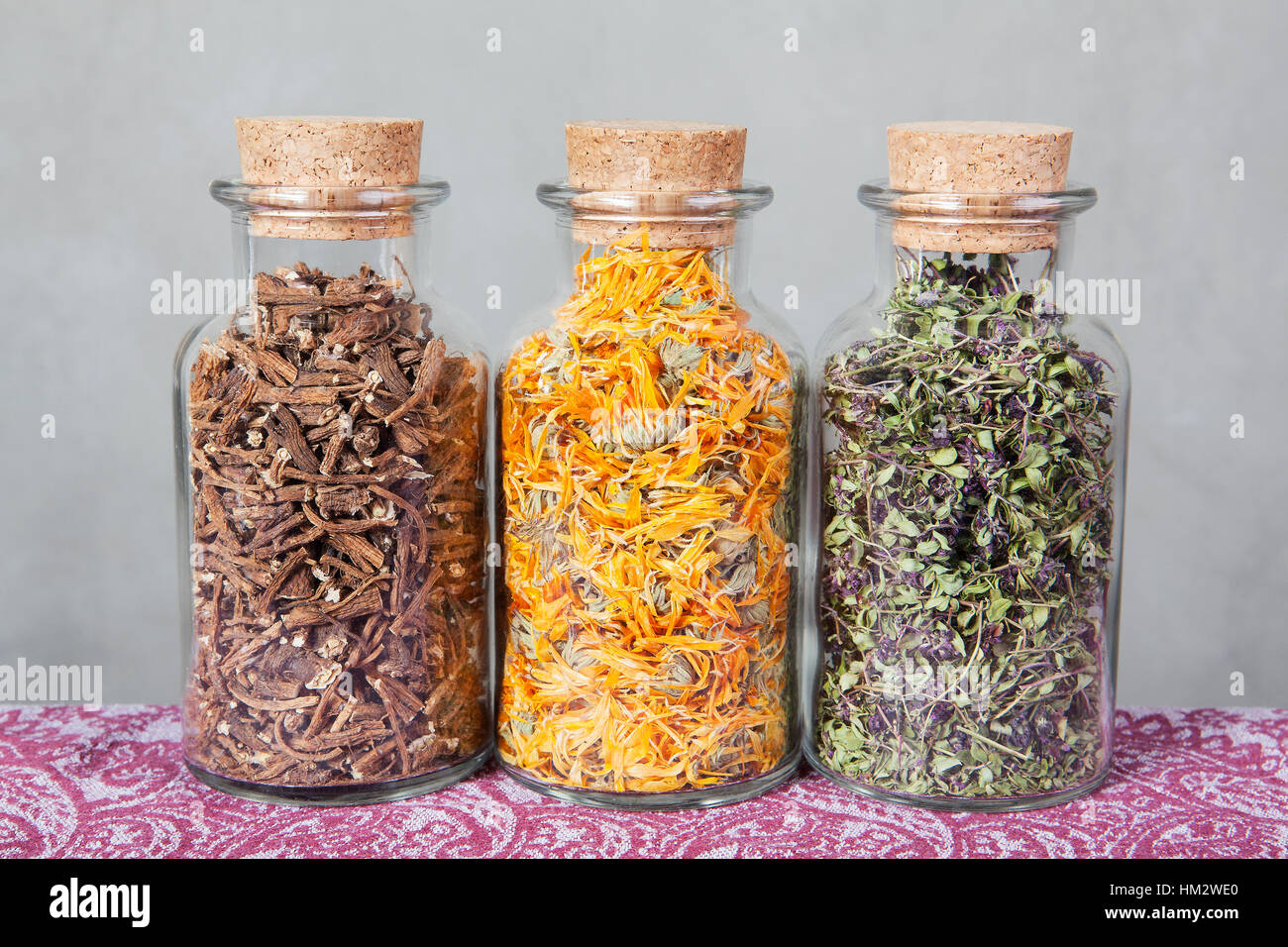 Dried teas herbs inside glass bottles Stock Photo Alamy