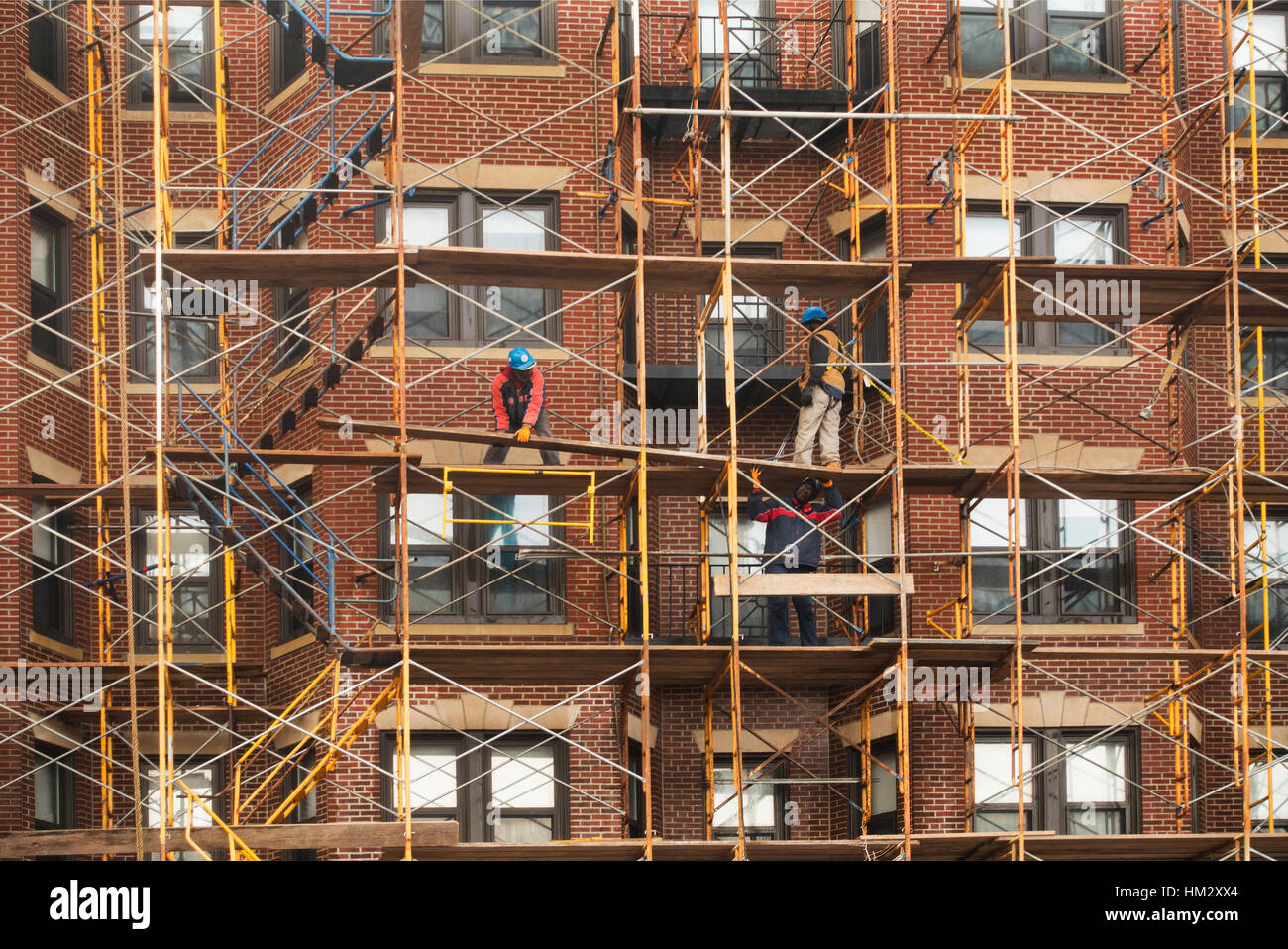 construction worker taking down scaffolding Boston MA Stock Photo Alamy
