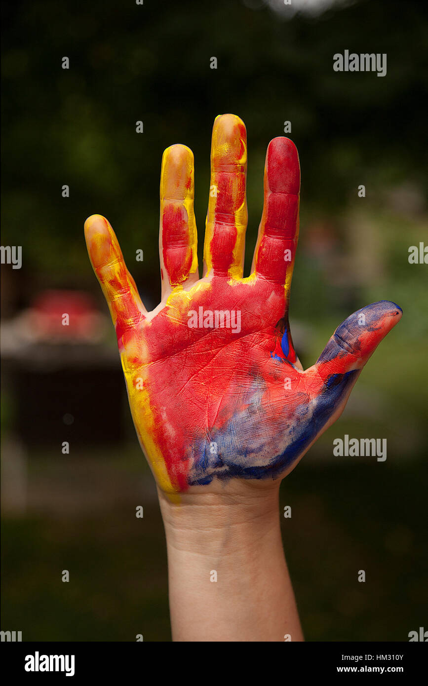 painted hand isolated on dark background Stock Photo