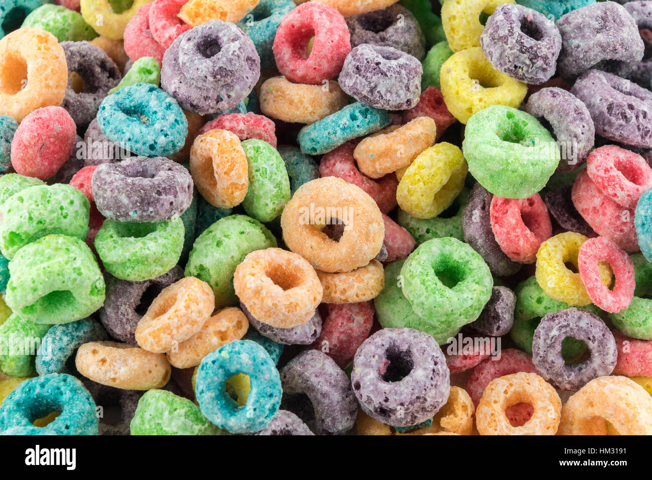 Coloured Fruit Loop breakfast cereal background Stock Photo - Alamy