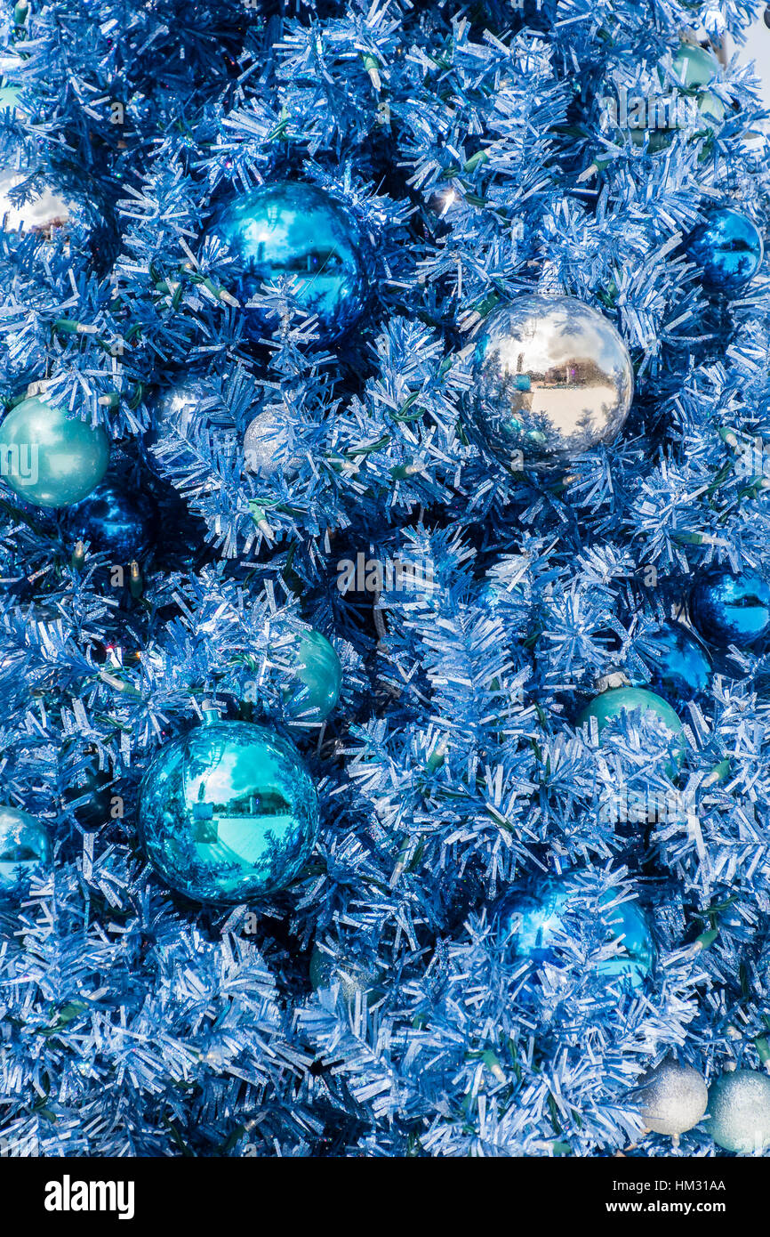 A closeup of a Christmas tree showing some decorations Stock Photo