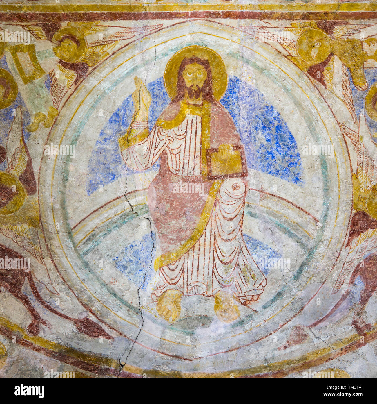 Medieval mural of Christ pantocrator, sitting on the rainbow. Symbols of the four evangelist, Lackalanga, Sweden - May 6, 2015, Stock Photo