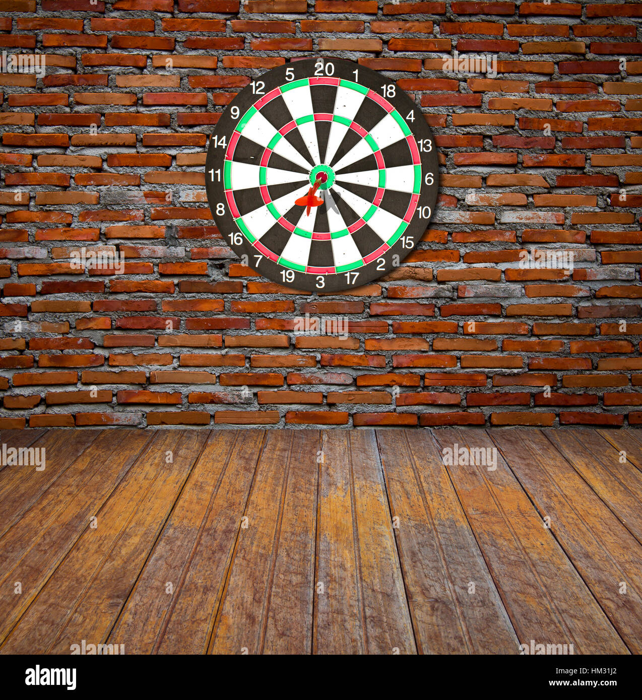 Dartboard on brick wall (miss darts Stock Photo Alamy